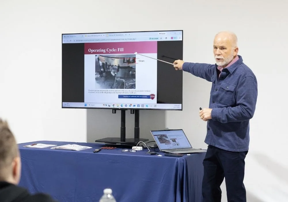 A trainer going over a tablet production course